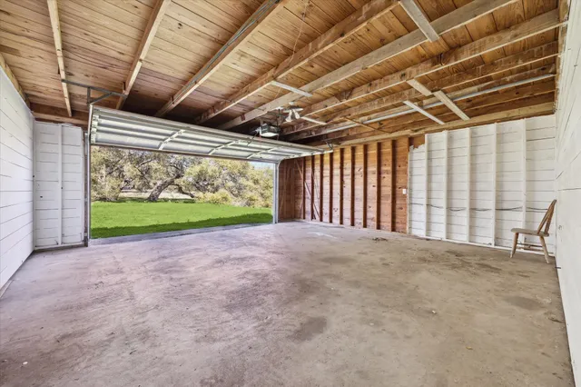 a view of porch with a garage