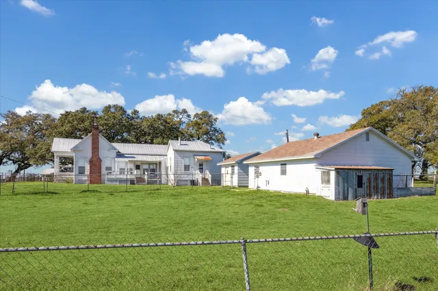 a view of a house with a big yard