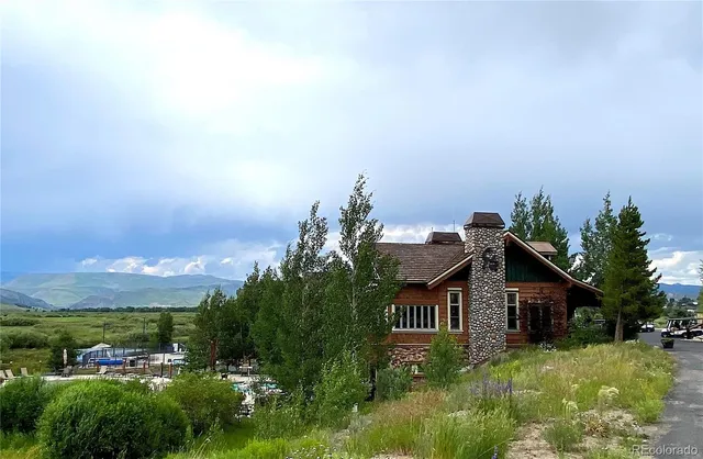 a front view of a house with a yard and porch