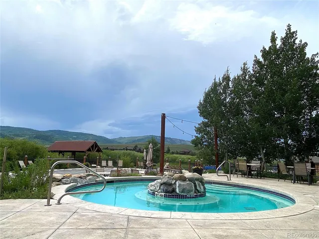 a view of a field with an ocean