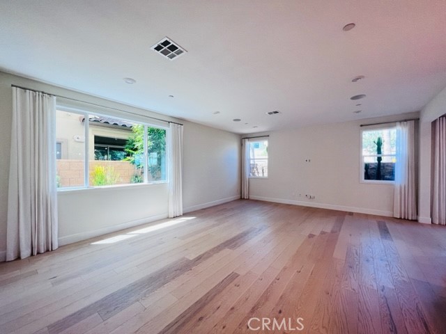 27613 Skylily Way San Pedro, CA 90732 - Photo 11 of 27 a view of an empty room with wooden floor and a window