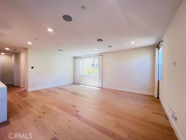 27613 Skylily Way San Pedro, CA 90732 - Photo 12 of 27 a view of an empty room with wooden floor