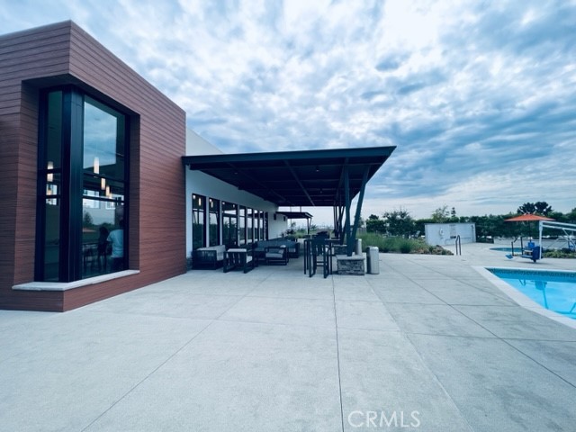 27613 Skylily Way San Pedro, CA 90732 - Photo 4 of 27 a view of a patio with table and chairs and potted plants