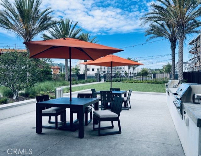 27613 Skylily Way San Pedro, CA 90732 - Photo 5 of 27 a view of a patio with a table chairs and a fire pit
