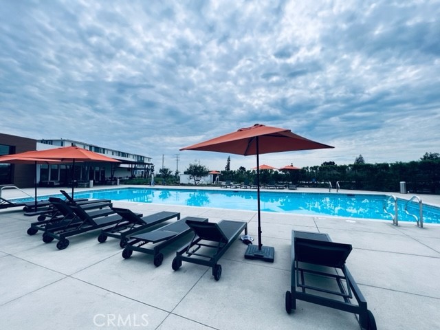 27613 Skylily Way San Pedro, CA 90732 - Photo 6 of 27 a view of a outdoor sitting area with furniture and umbrella