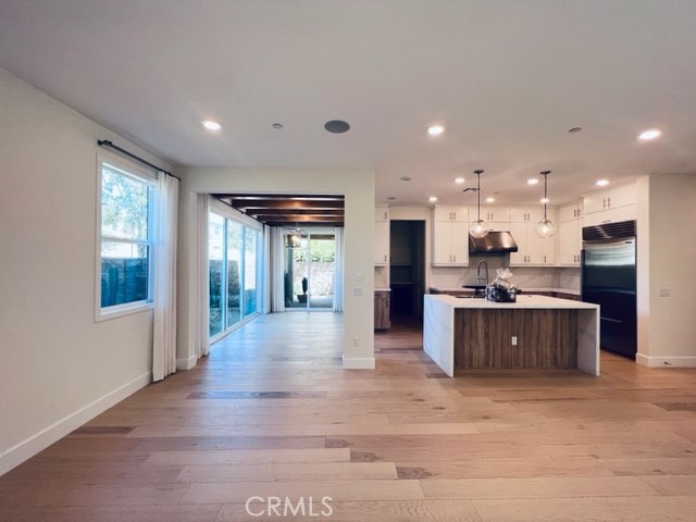 27613 Skylily Way San Pedro, CA 90732 - Photo 8 of 27 a large kitchen with stainless steel appliances kitchen island granite countertop a large counter top and oven