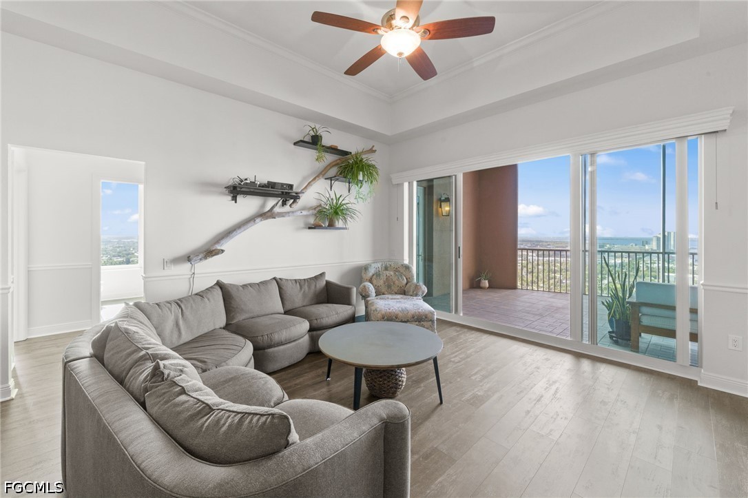 2743 First Street, Unit 2703 Fort Myers, FL 33916 - Photo 14 of 50 a living room with furniture and a large window