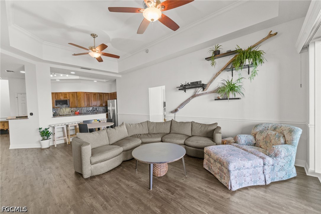 2743 First Street, Unit 2703 Fort Myers, FL 33916 - Photo 15 of 50 a living room with furniture and a wooden floor