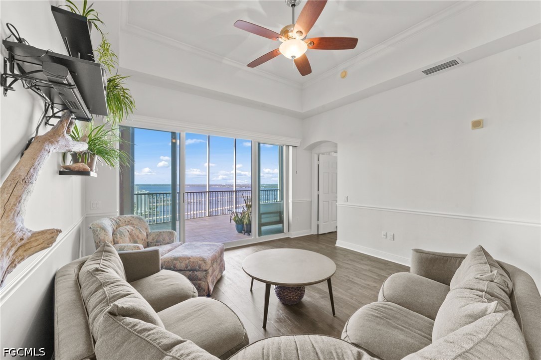 2743 First Street, Unit 2703 Fort Myers, FL 33916 - Photo 16 of 50 a living room with furniture and a large window