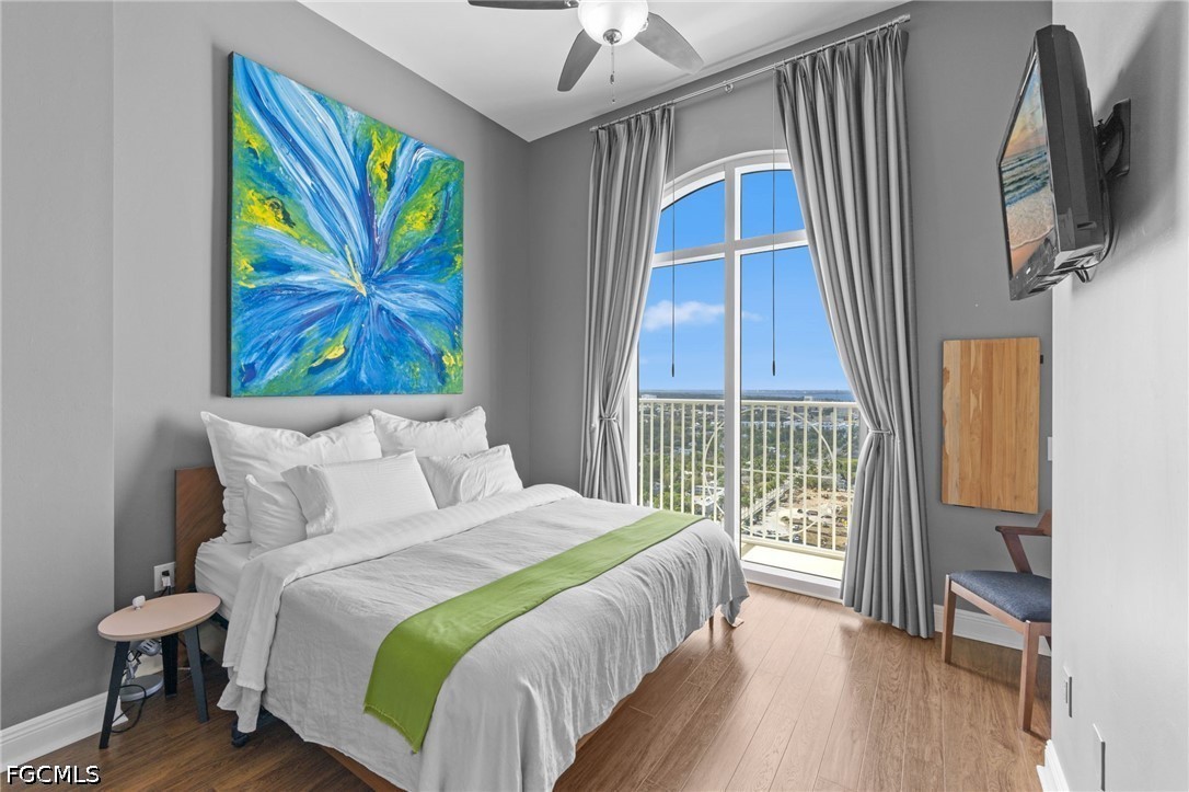 2743 First Street, Unit 2703 Fort Myers, FL 33916 - Photo 25 of 50 a bedroom with a bed and a window