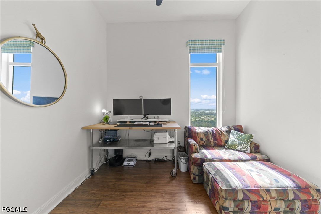 2743 First Street, Unit 2703 Fort Myers, FL 33916 - Photo 29 of 50 a living room with a bed and a couch