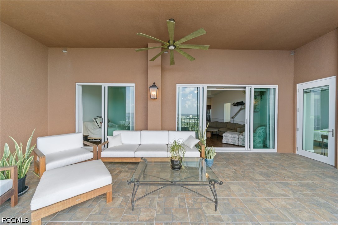 2743 First Street, Unit 2703 Fort Myers, FL 33916 - Photo 33 of 50 a outdoor space with patio the couches and a dining table with garden view