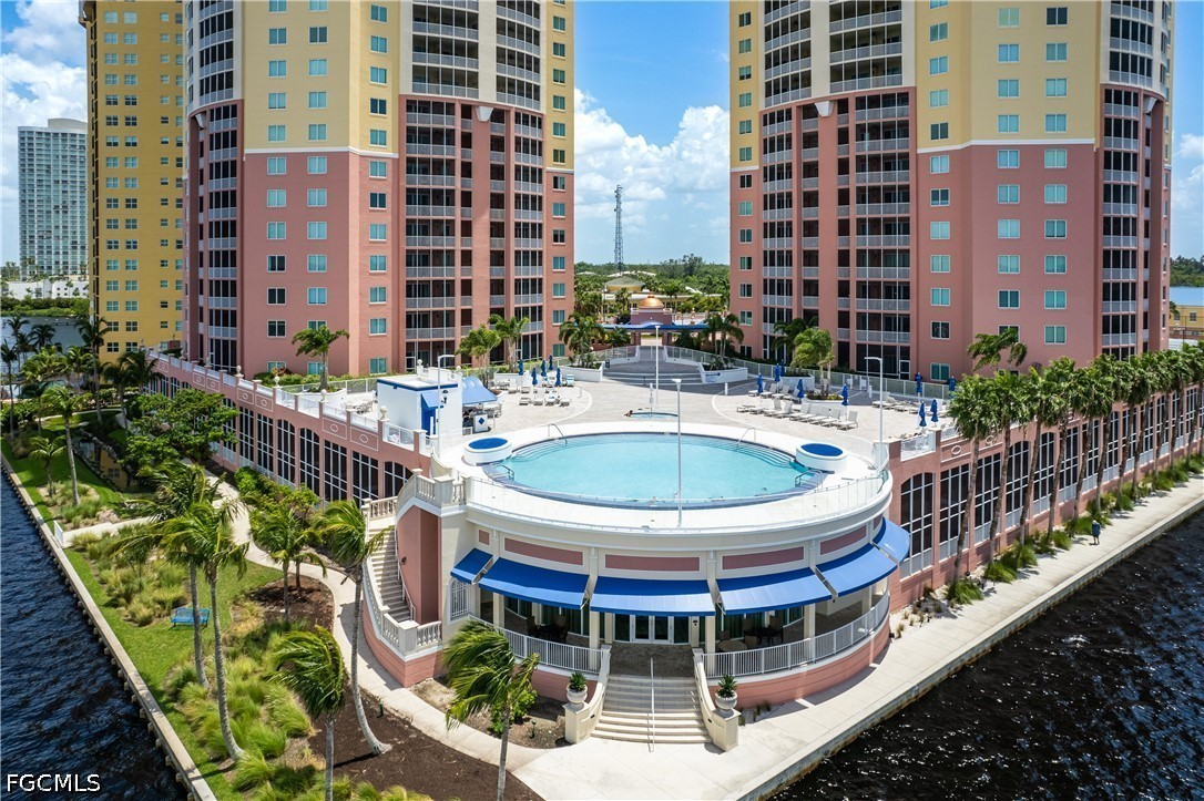 2743 First Street, Unit 2703 Fort Myers, FL 33916 - Photo 48 of 50 a view of a balcony with a potted plant and outdoor seating