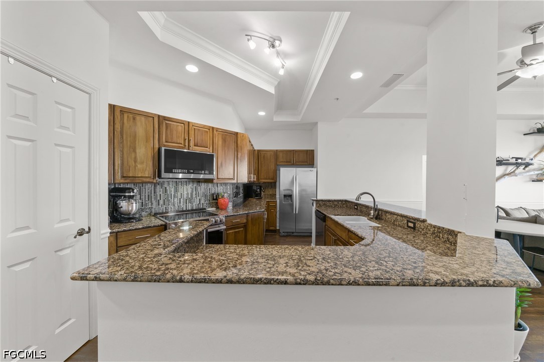 2743 First Street, Unit 2703 Fort Myers, FL 33916 - Photo 7 of 50 a kitchen with sink stove and granite counter top