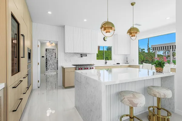 a kitchen with cabinets and window