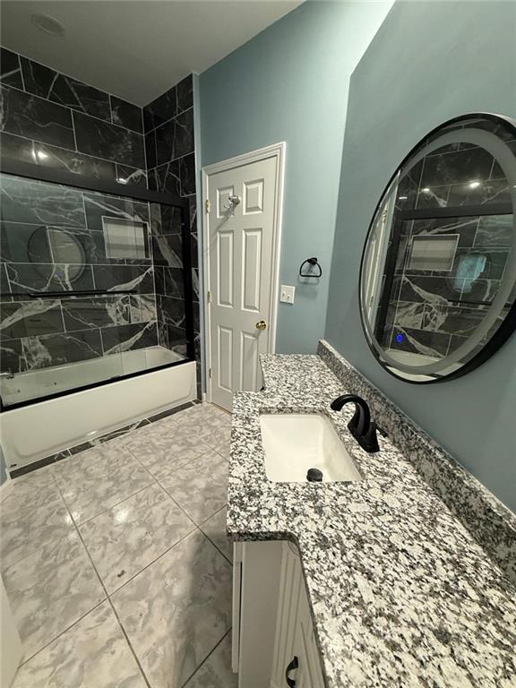 2337 Hollonville Road Brooks, GA 30205 - Photo 24 of 50 a bathroom with a granite countertop sink a mirror and shower