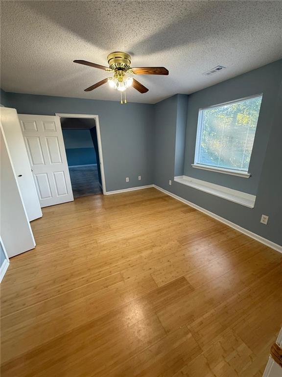 2337 Hollonville Road Brooks, GA 30205 - Photo 34 of 50 a view of an empty room with window and wooden floor