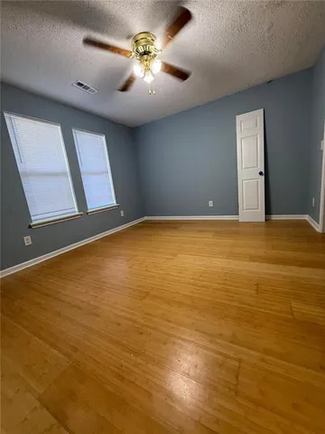 a spacious bathroom with double vanity and a mirror