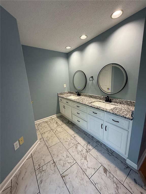 2337 Hollonville Road Brooks, GA 30205 - Photo 41 of 50 a spacious bathroom with double vanity and a mirror