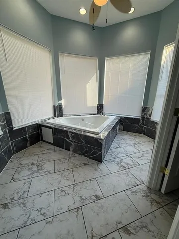 a bathroom with a glass shower door