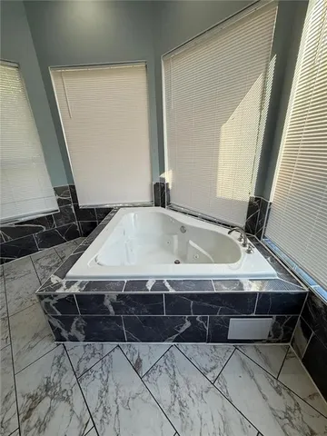 a view of balcony with wooden floor