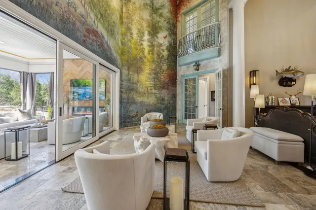 a kitchen with granite countertop white cabinets and stainless steel appliances