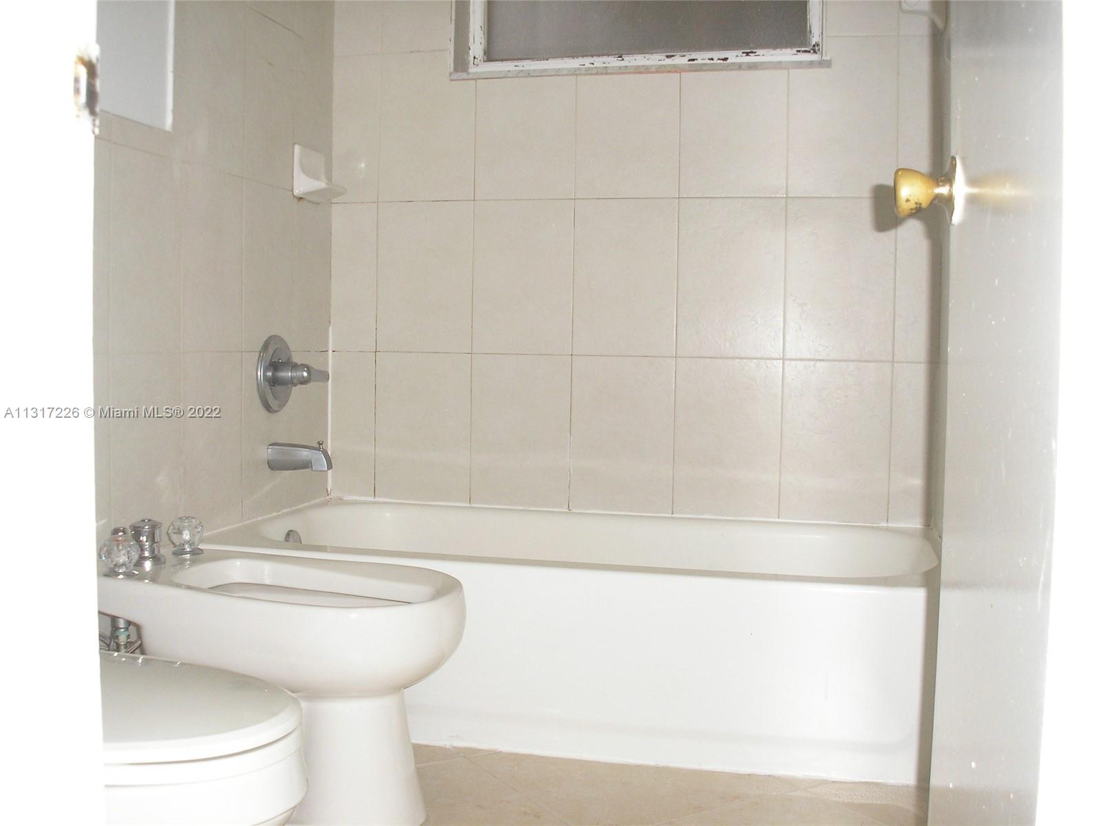 Fountainebleau Miami, FL 33174 - Photo 12 of 16 a bathroom with a sink and mirror