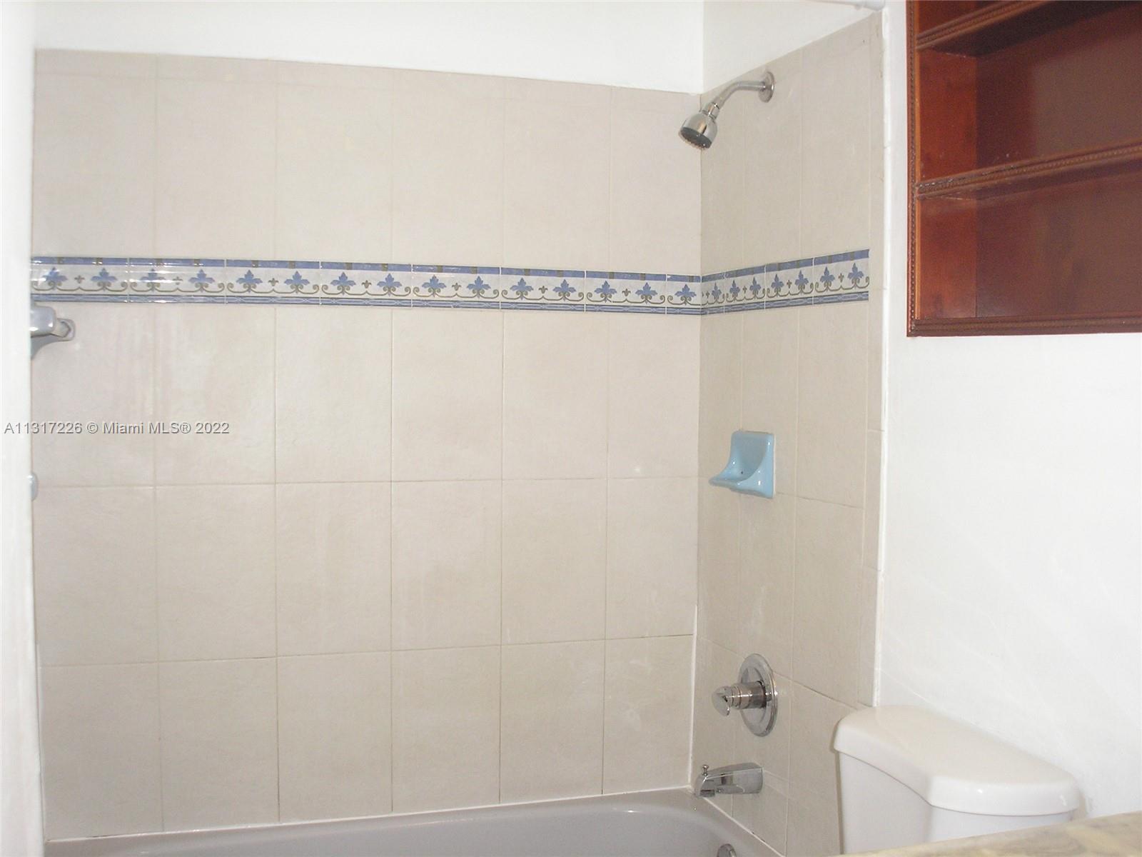 Fountainebleau Miami, FL 33174 - Photo 9 of 16 a bathroom with a shower and a shower