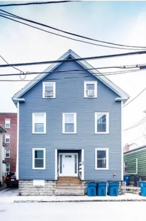 a red brick house with large windows