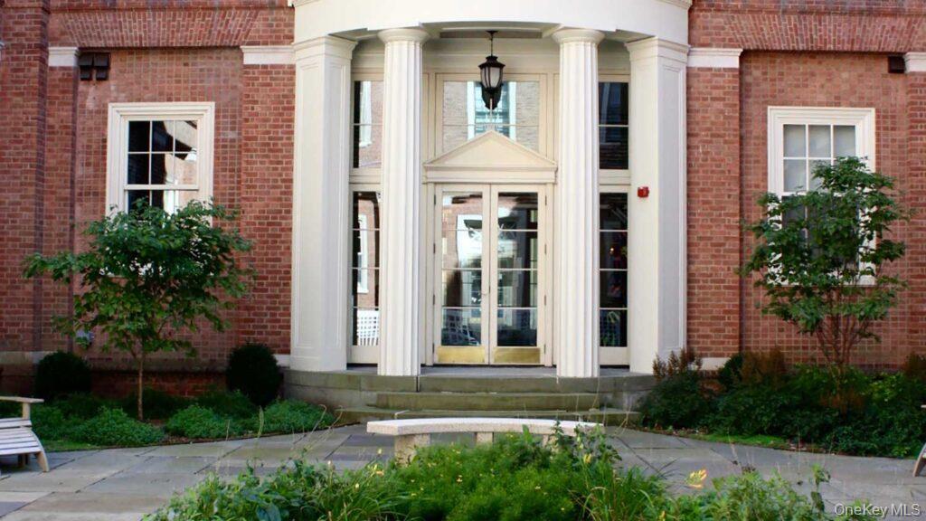 480 Bedford Road, Unit 401 Chappaqua, NY 10514 - Photo 5 of 12 View of exterior entry with french doors and brick siding