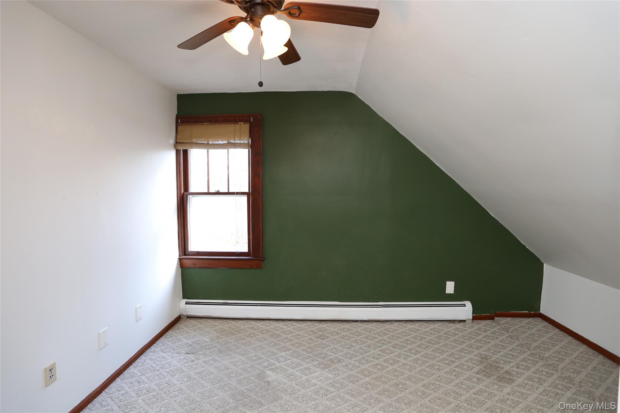113 Brewery Road New City, NY 10956 - Photo 22 of 39 Additional living space featuring carpet flooring, vaulted ceiling, a baseboard heating unit, and ceiling fan