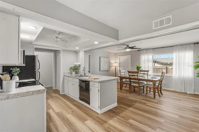 a kitchen with a sink stove and refrigerator