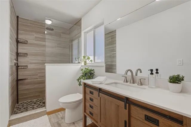 a spacious bedroom with a bed and a window