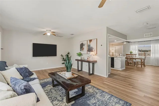 a living room with furniture and a table