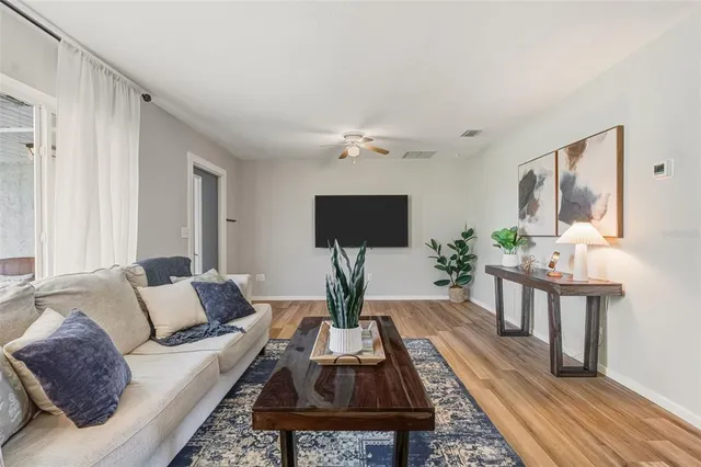 a kitchen with a table chairs stove and cabinets