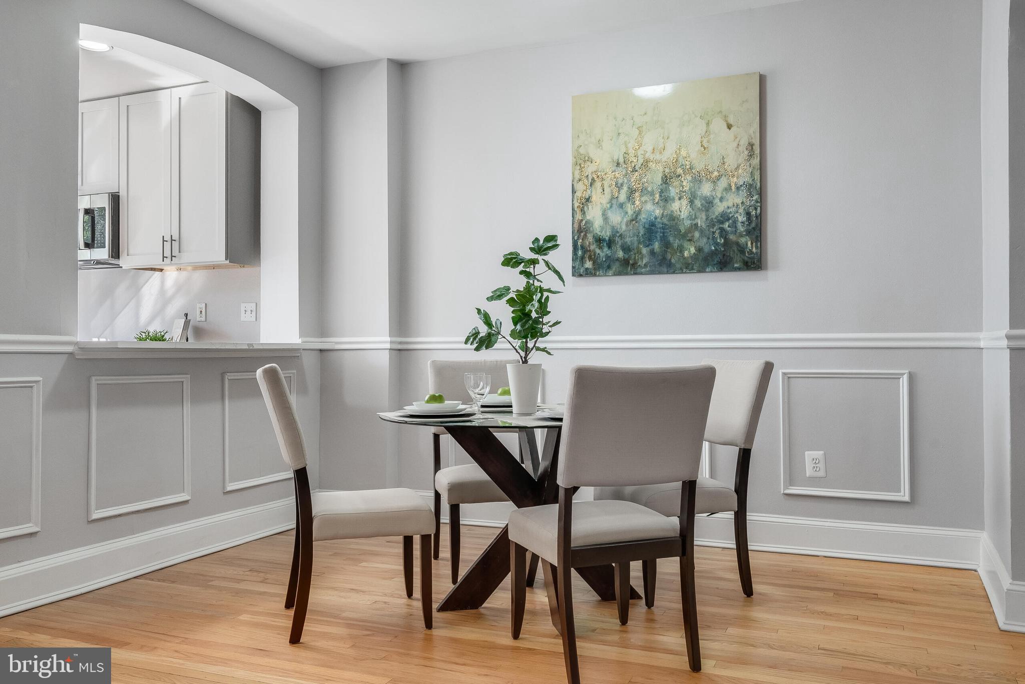 2116 North Capitol Street Northwest Washington, DC 20002 - Photo 14 of 50 a view of a dining room with furniture and wooden floor