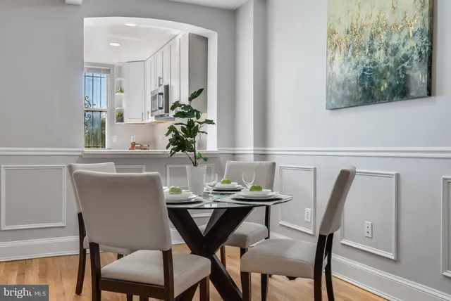 a view of a dining room with furniture and wooden floor