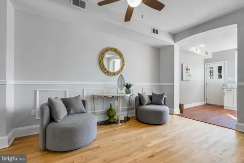 a kitchen with granite countertop a refrigerator and a stove top oven