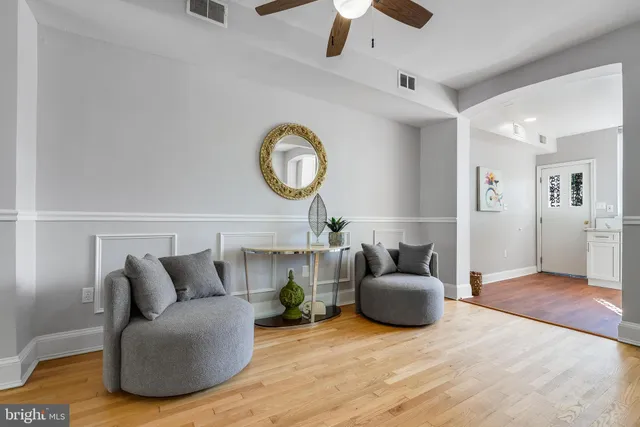 a kitchen with granite countertop a refrigerator and a stove top oven