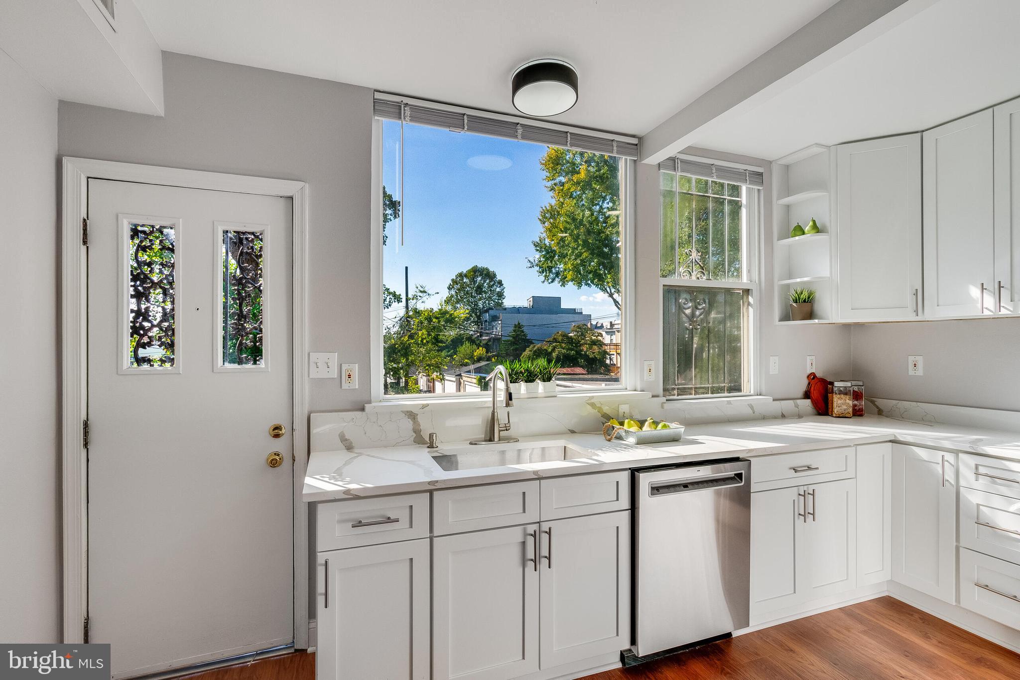 2116 North Capitol Street Northwest Washington, DC 20002 - Photo 22 of 50 a kitchen with a sink and cabinets