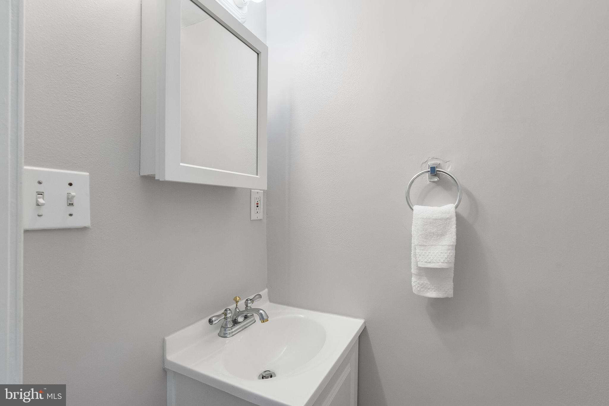 2116 North Capitol Street Northwest Washington, DC 20002 - Photo 23 of 50 a bathroom with a sink and mirror