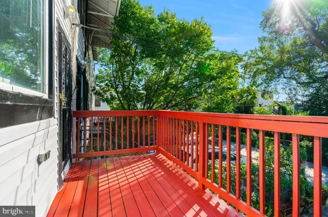 a bedroom with a bed lamps and window