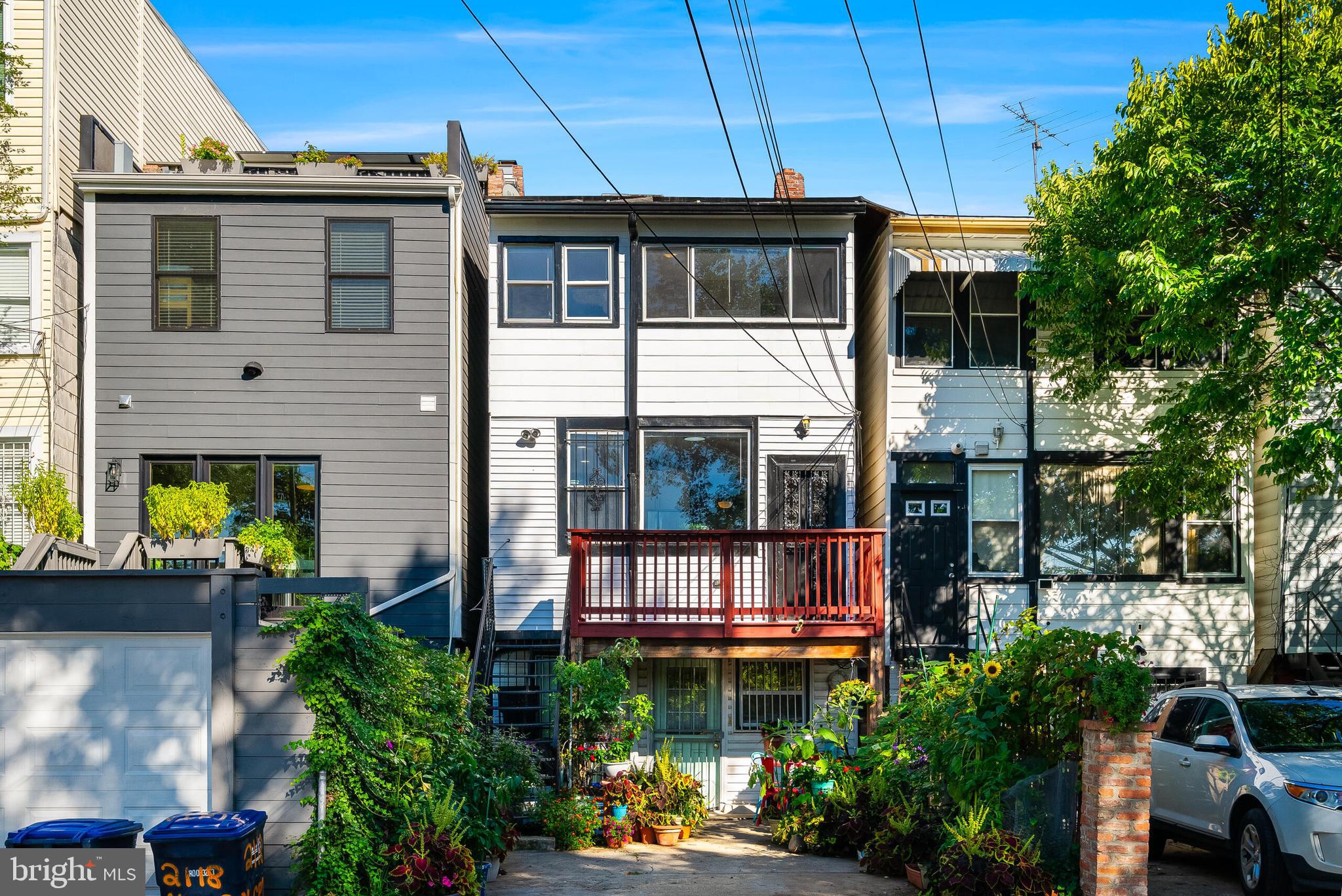 2116 North Capitol Street Northwest Washington, DC 20002 - Photo 27 of 50 a view of a house with potted plants and a yard