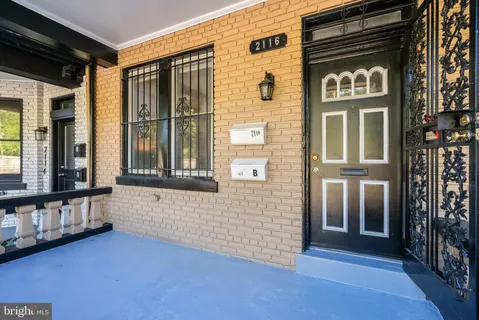a view of front door of house with a street