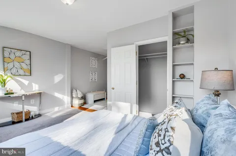 a living room with furniture and potted plant