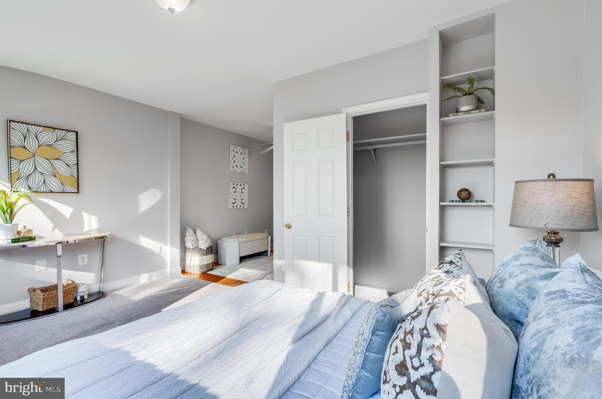 2116 North Capitol Street Northwest Washington, DC 20002 - Photo 31 of 50 a bedroom with a bed and a lamp on the dresser