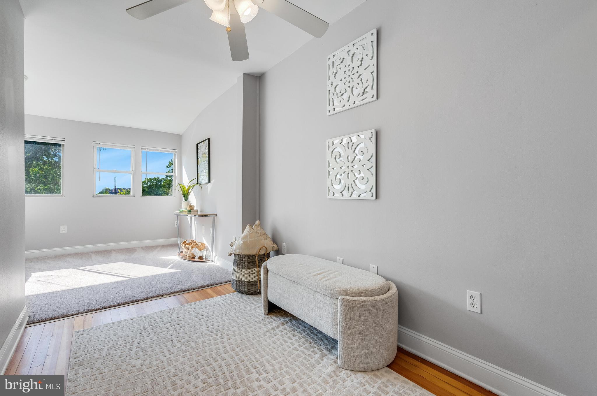2116 North Capitol Street Northwest Washington, DC 20002 - Photo 37 of 50 a spacious bedroom with a bed and a chandelier