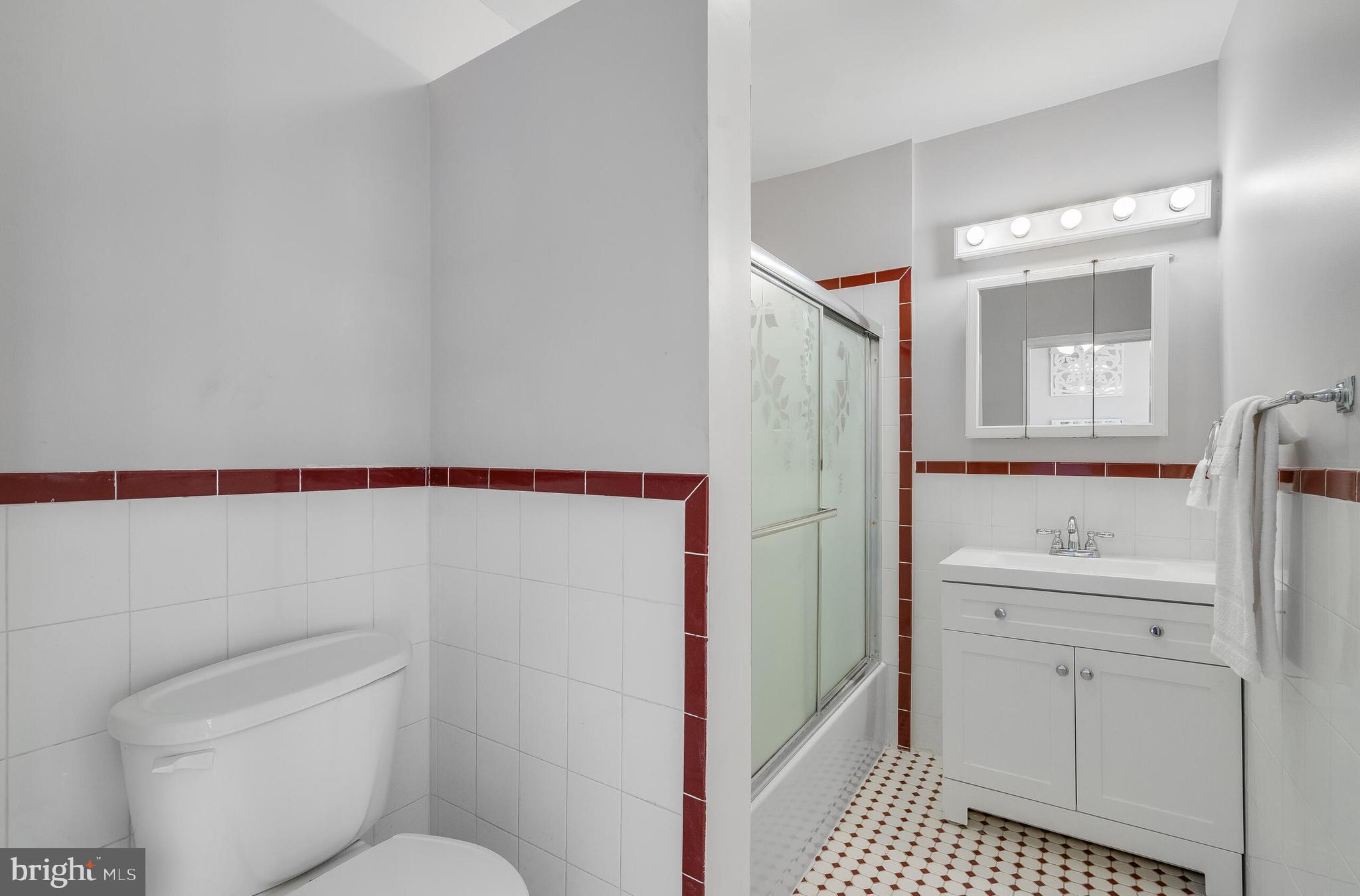 2116 North Capitol Street Northwest Washington, DC 20002 - Photo 38 of 50 a bathroom with a sink toilet and shower