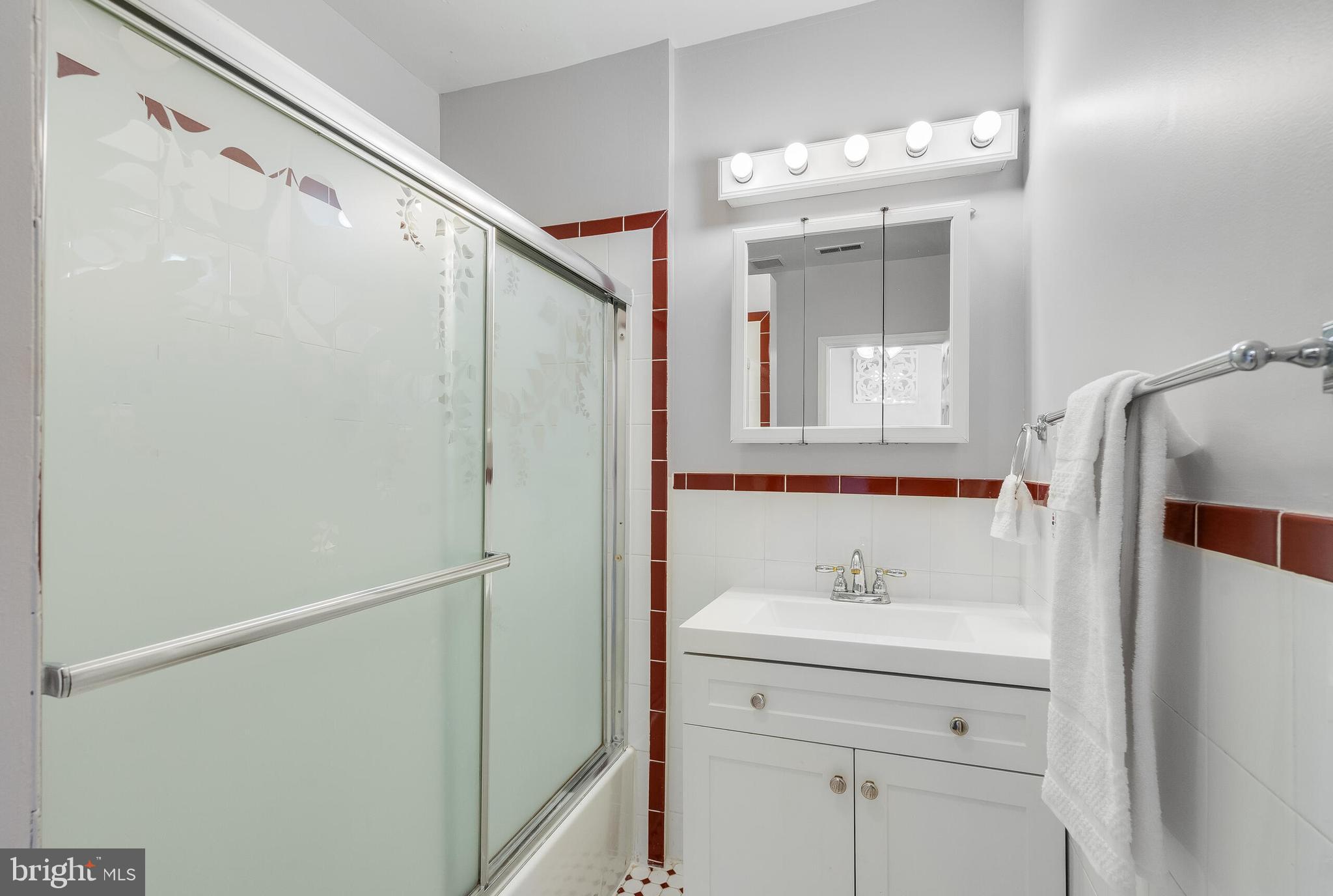 2116 North Capitol Street Northwest Washington, DC 20002 - Photo 39 of 50 a bathroom with a sink vanity and a mirror