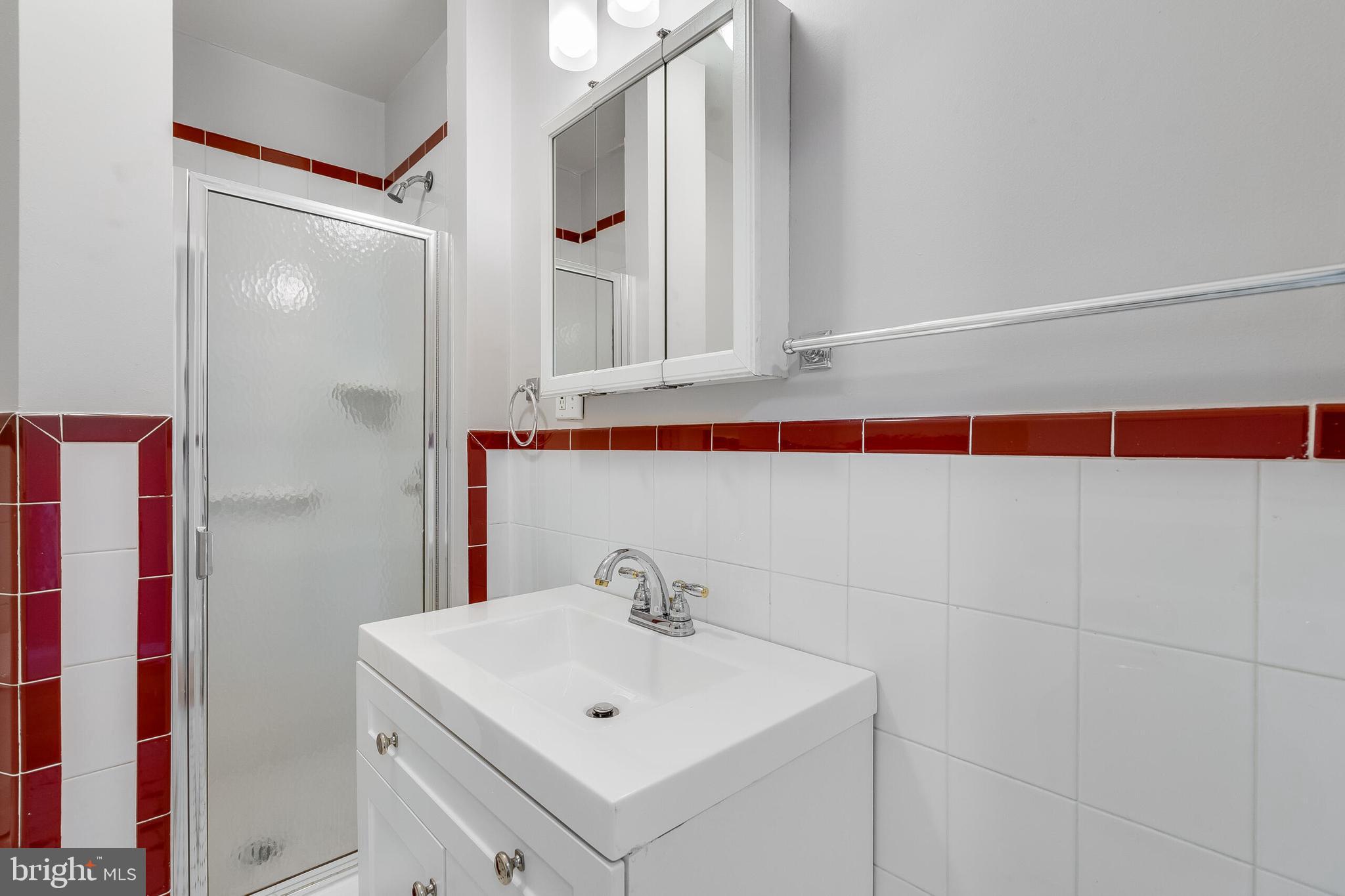 2116 North Capitol Street Northwest Washington, DC 20002 - Photo 48 of 50 a bathroom with a sink and a mirror